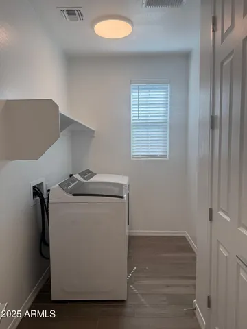 a utility room with washer and dryer