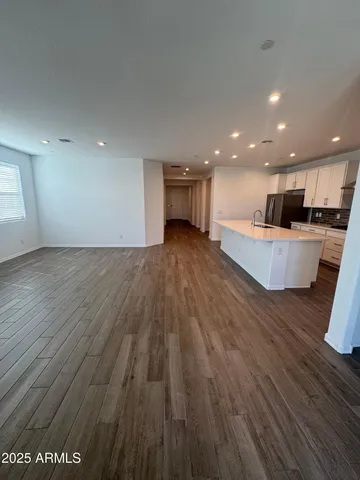 a view of kitchen and kitchen with sink