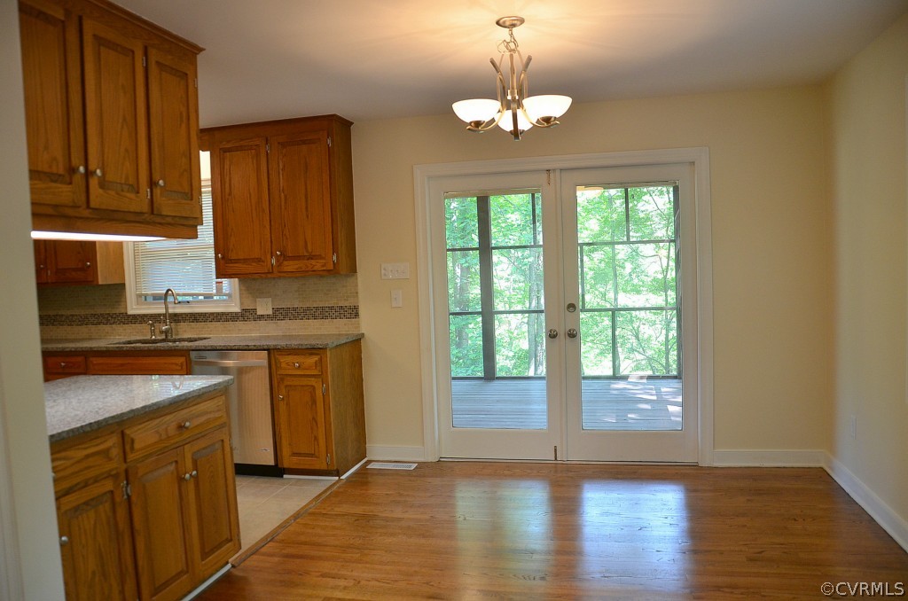 4940 Windsor Road Sandston, VA 23150 - Photo 11 of 22 a view of kitchen with granite countertop cabinets and wooden floor