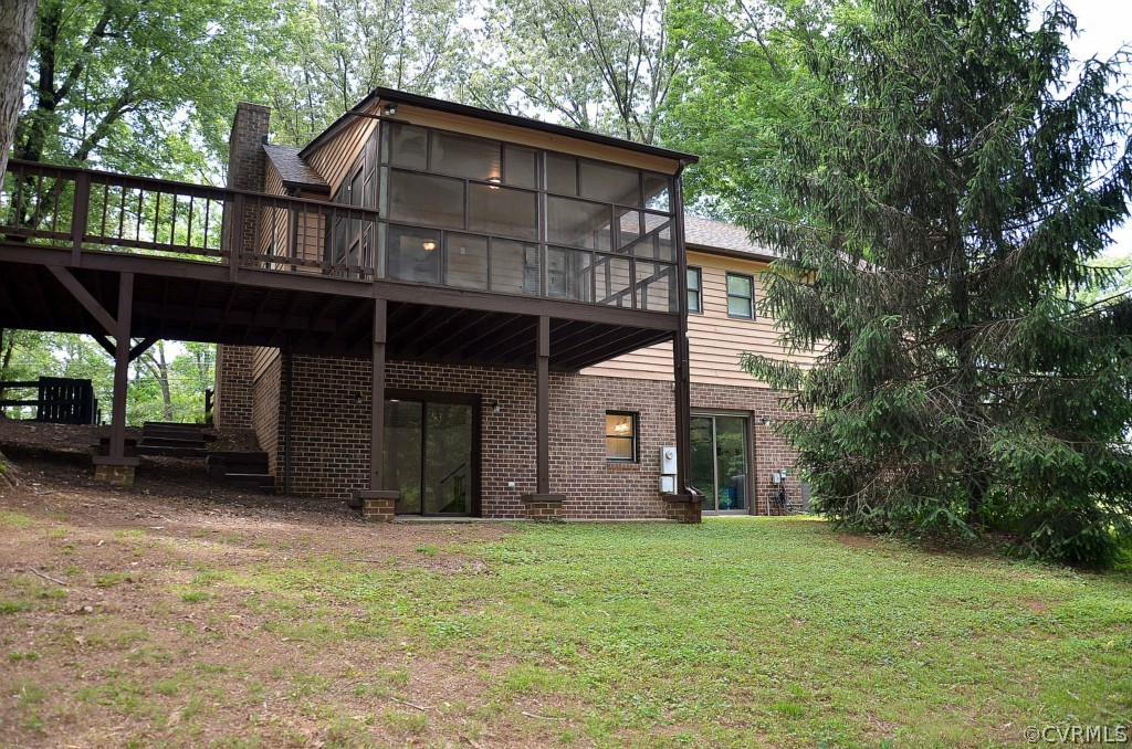 4940 Windsor Road Sandston, VA 23150 - Photo 2 of 22 a front view of a house with garden