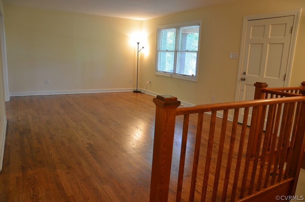 4940 Windsor Road Sandston, VA 23150 - Photo 5 of 22 a view of a hallway with wooden floor and staircase