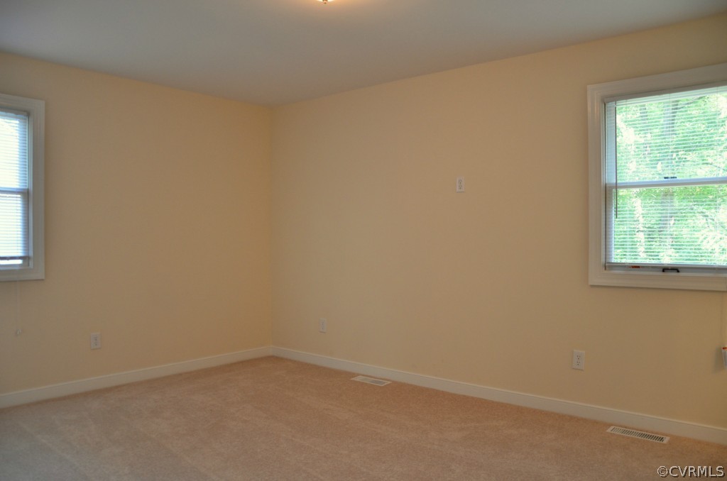 4940 Windsor Road Sandston, VA 23150 - Photo 8 of 22 an empty room with a window