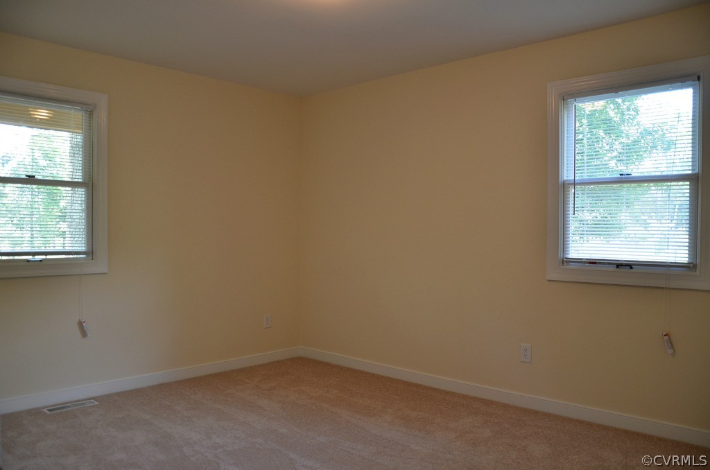 4940 Windsor Road Sandston, VA 23150 - Photo 10 of 22 an empty room with a window