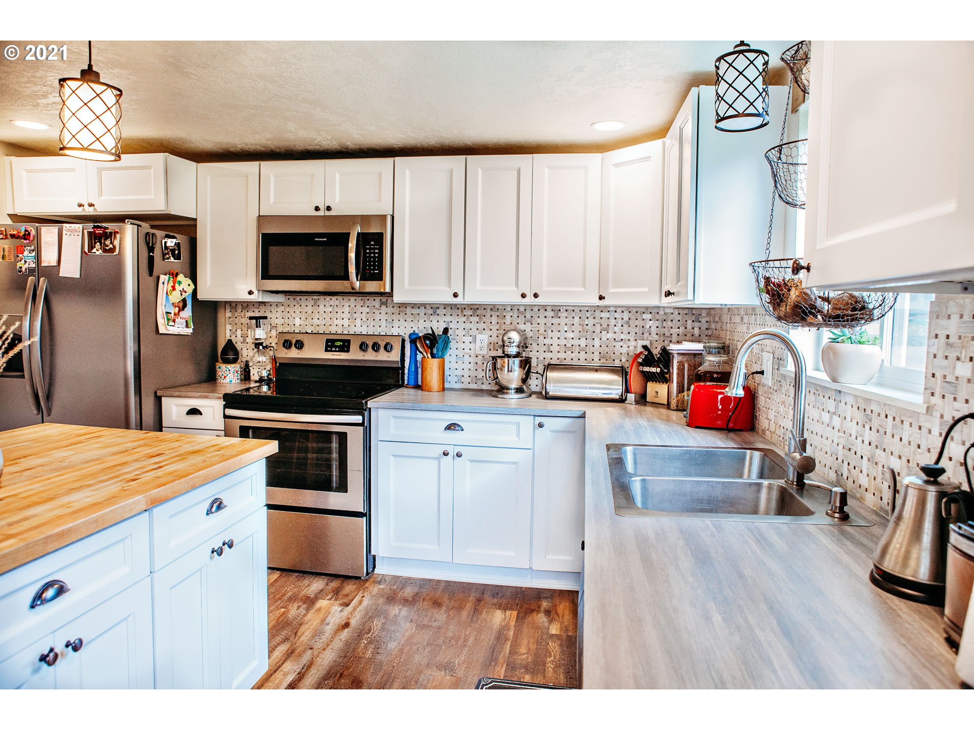 577 South 35th Street Springfield, OR 97478 - Photo 5 of 14 a kitchen that has a lot of cabinets and refrigerator