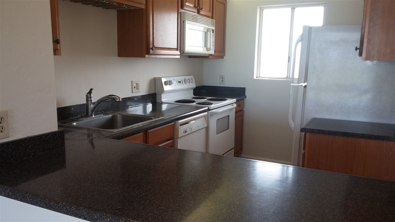 760 South Kihei Road, Unit 225 Kihei, HI 96753 - Photo 6 of 14 a kitchen with a sink and cabinets