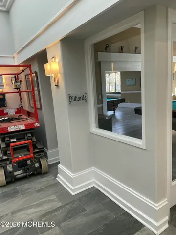 a view of a livingroom with wooden floor and a window