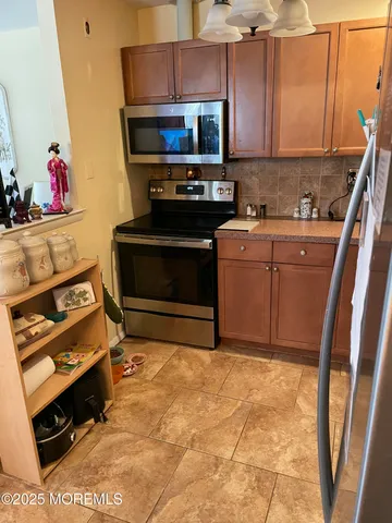 a kitchen with a stove and a microwave