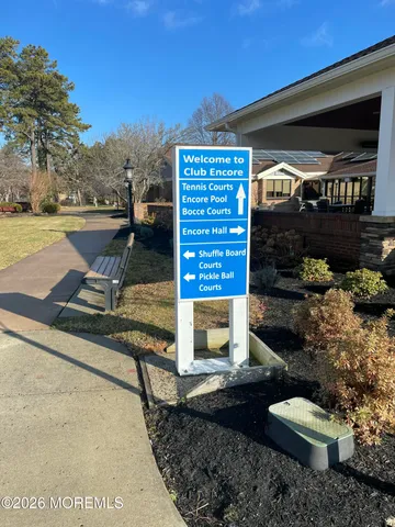 a view of a porch with furniture and a yard