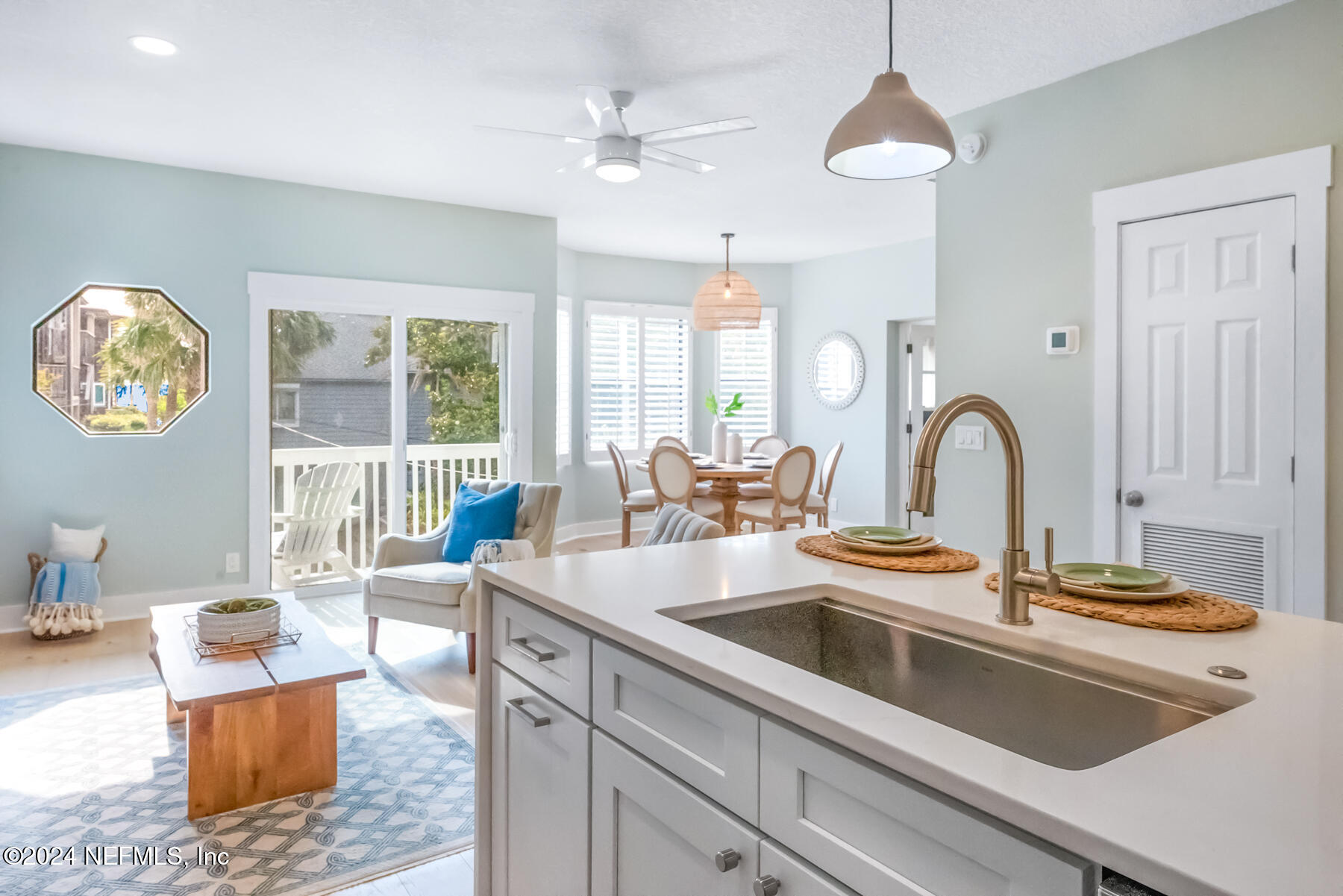 1850 Beach Avenue Atlantic Beach, FL 32233 - Photo 11 of 52 a kitchen with stainless steel appliances granite countertop a sink a stove and a dining table with white countertops