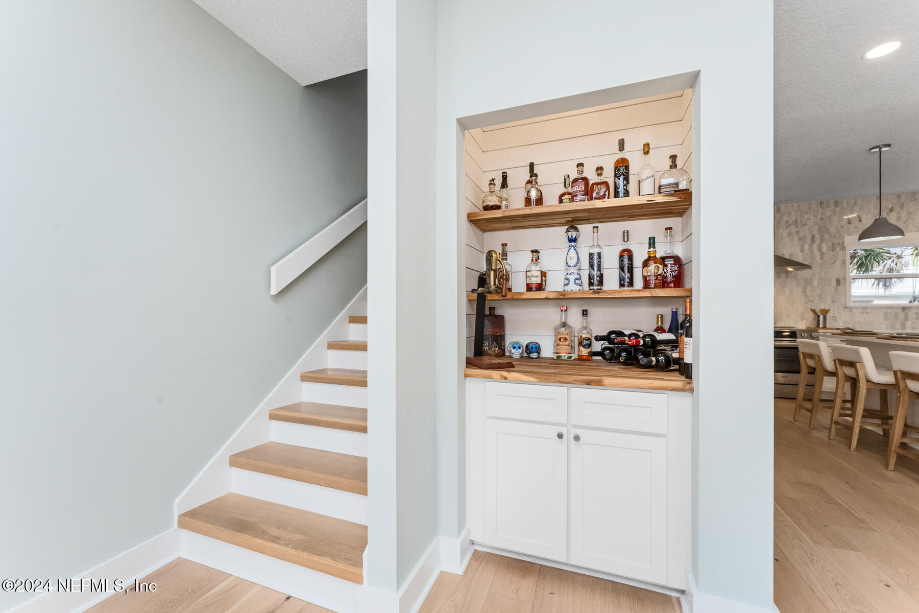 1850 Beach Avenue Atlantic Beach, FL 32233 - Photo 17 of 52 a workspace with white cabinets and wooden floor