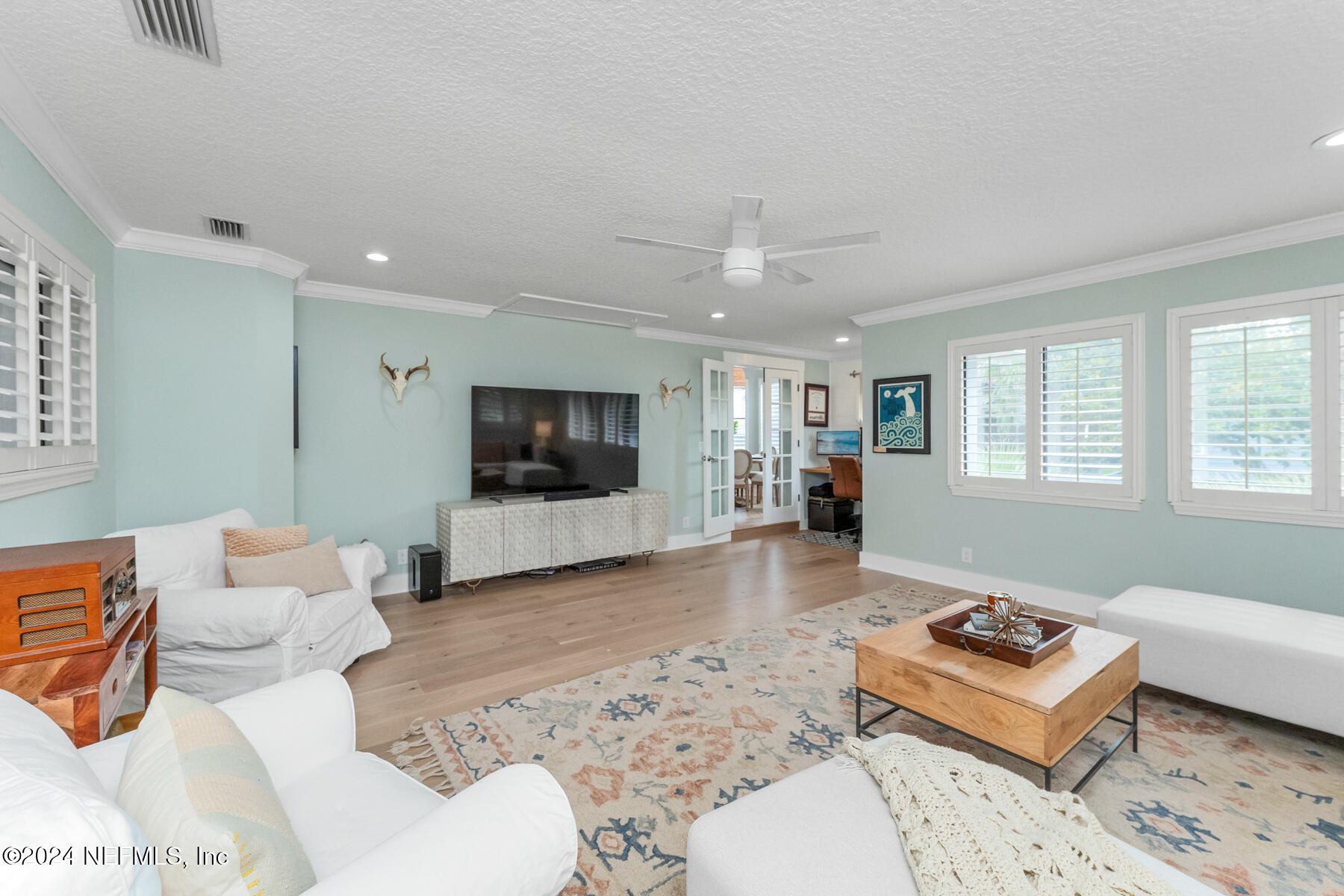1850 Beach Avenue Atlantic Beach, FL 32233 - Photo 19 of 52 a living room with furniture and a flat screen tv