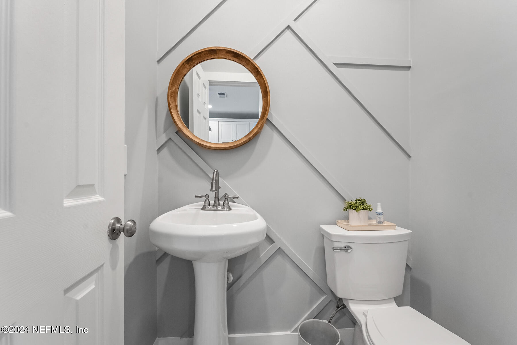 1850 Beach Avenue Atlantic Beach, FL 32233 - Photo 20 of 52 a bathroom with a sink mirror and toilet