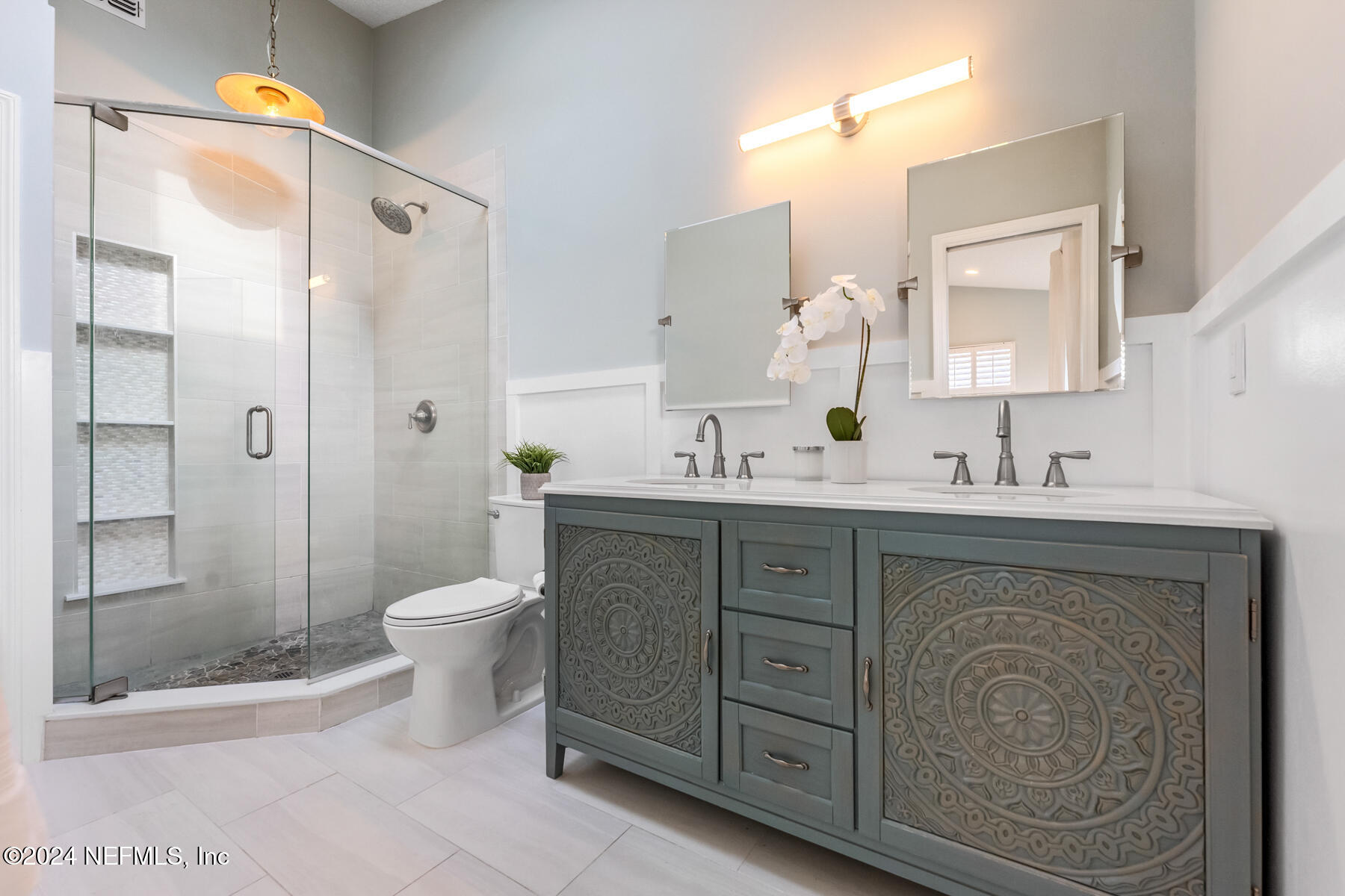 1850 Beach Avenue Atlantic Beach, FL 32233 - Photo 31 of 52 a bathroom with a double vanity sink toilet and shower