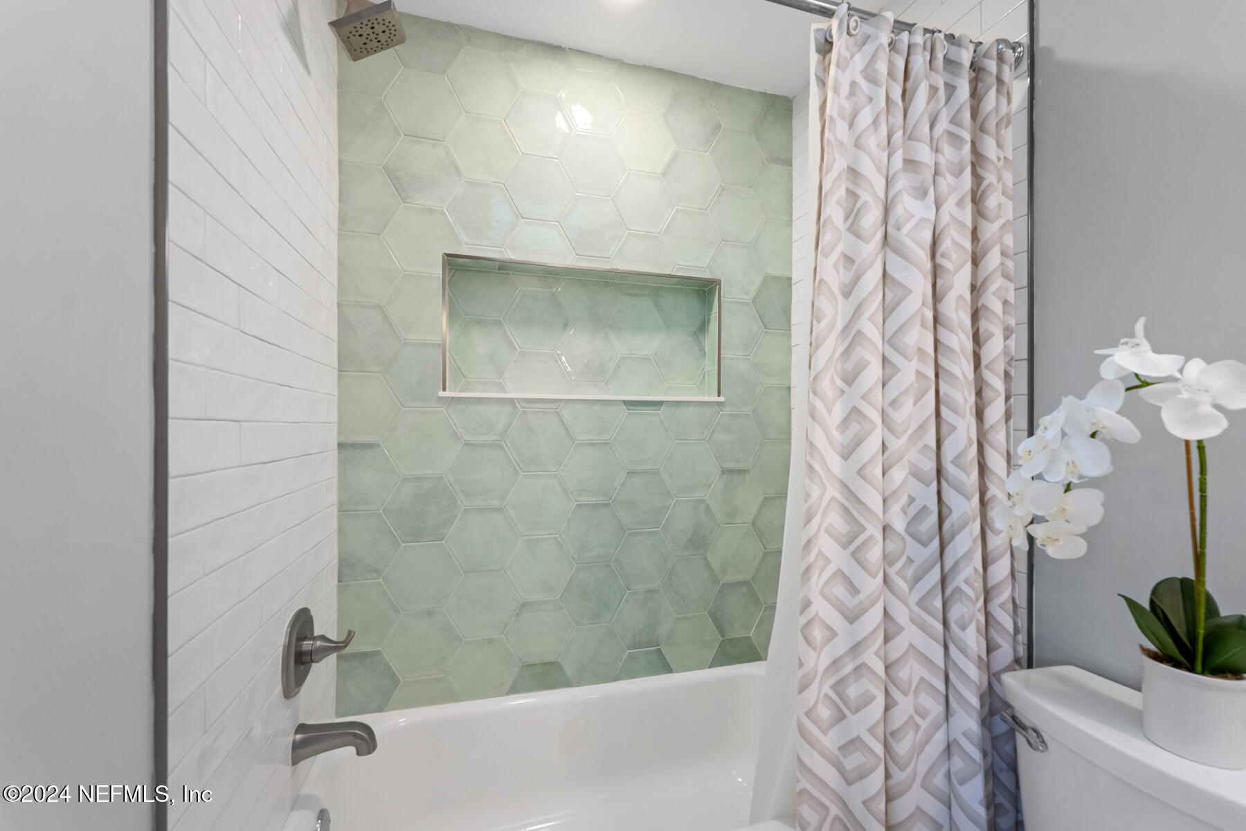 1850 Beach Avenue Atlantic Beach, FL 32233 - Photo 35 of 52 a bathroom with a shower curtain and a sink