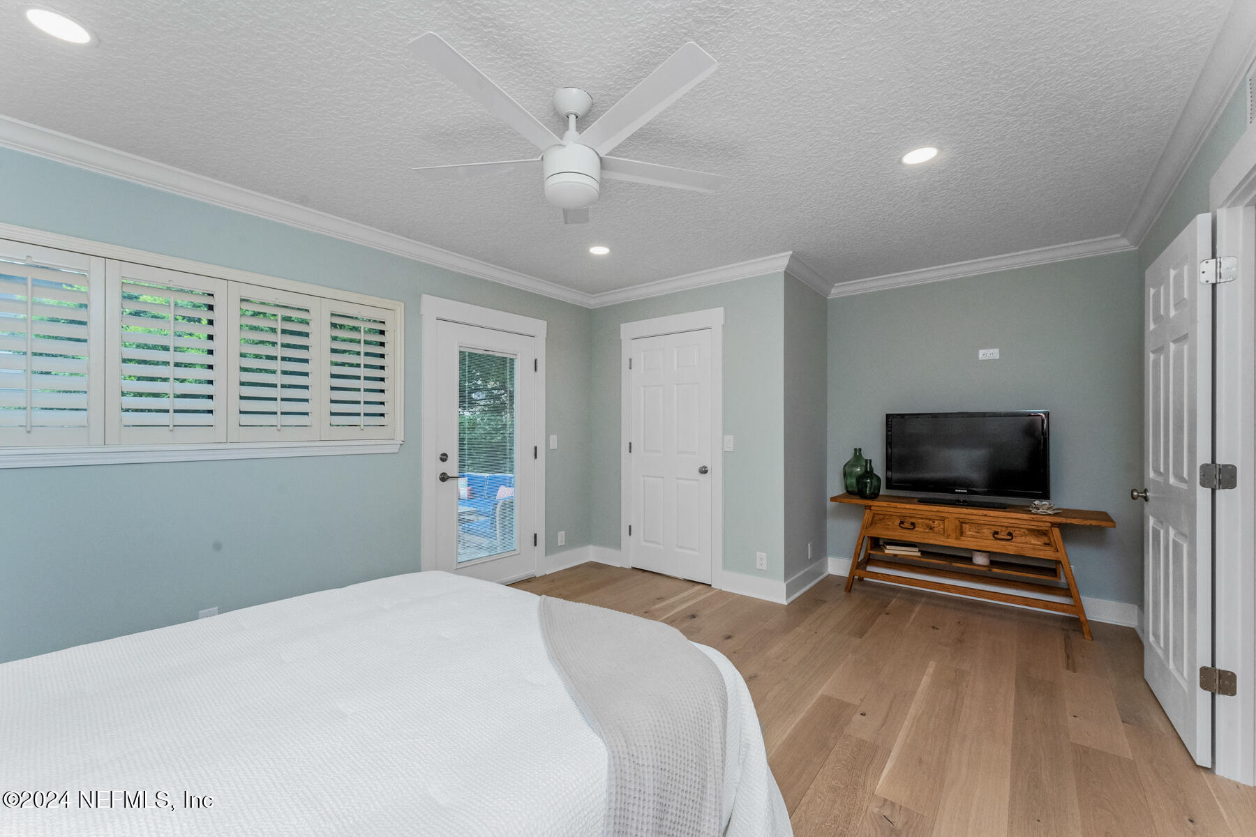 1850 Beach Avenue Atlantic Beach, FL 32233 - Photo 38 of 52 a bedroom with a bed and flat screen tv