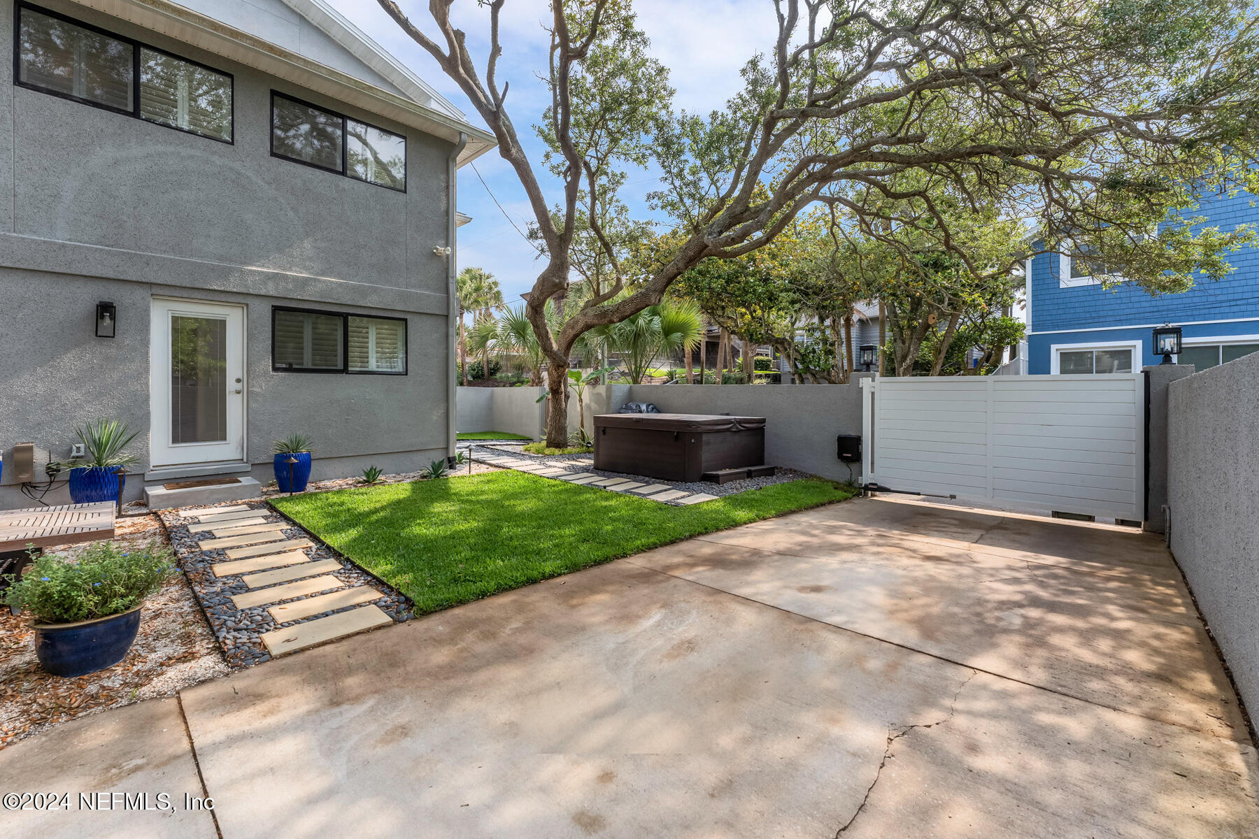 1850 Beach Avenue Atlantic Beach, FL 32233 - Photo 45 of 52 a front view of a house with a yard and potted plants