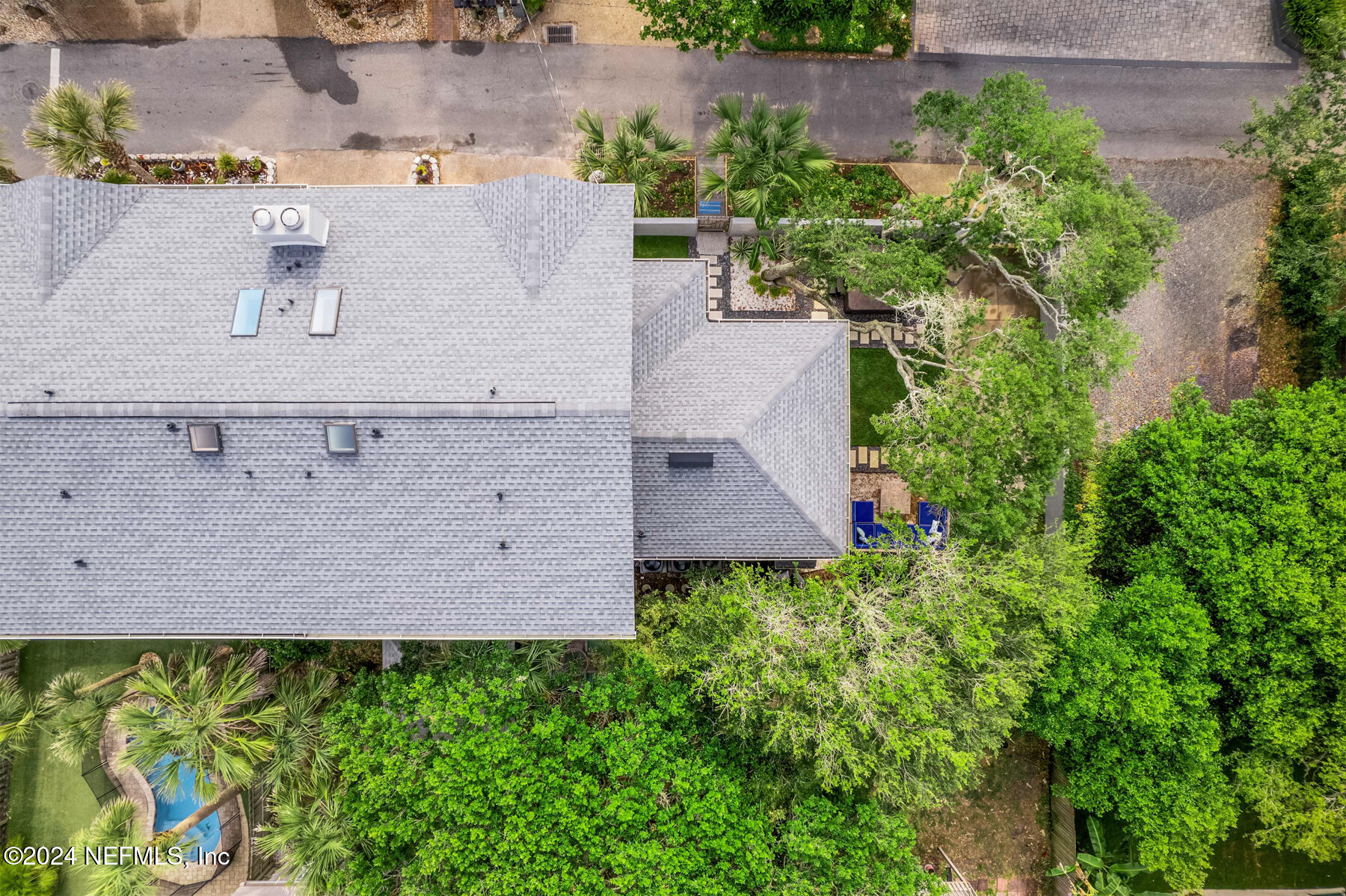 1850 Beach Avenue Atlantic Beach, FL 32233 - Photo 49 of 52 an aerial view of a house with a yard and large trees