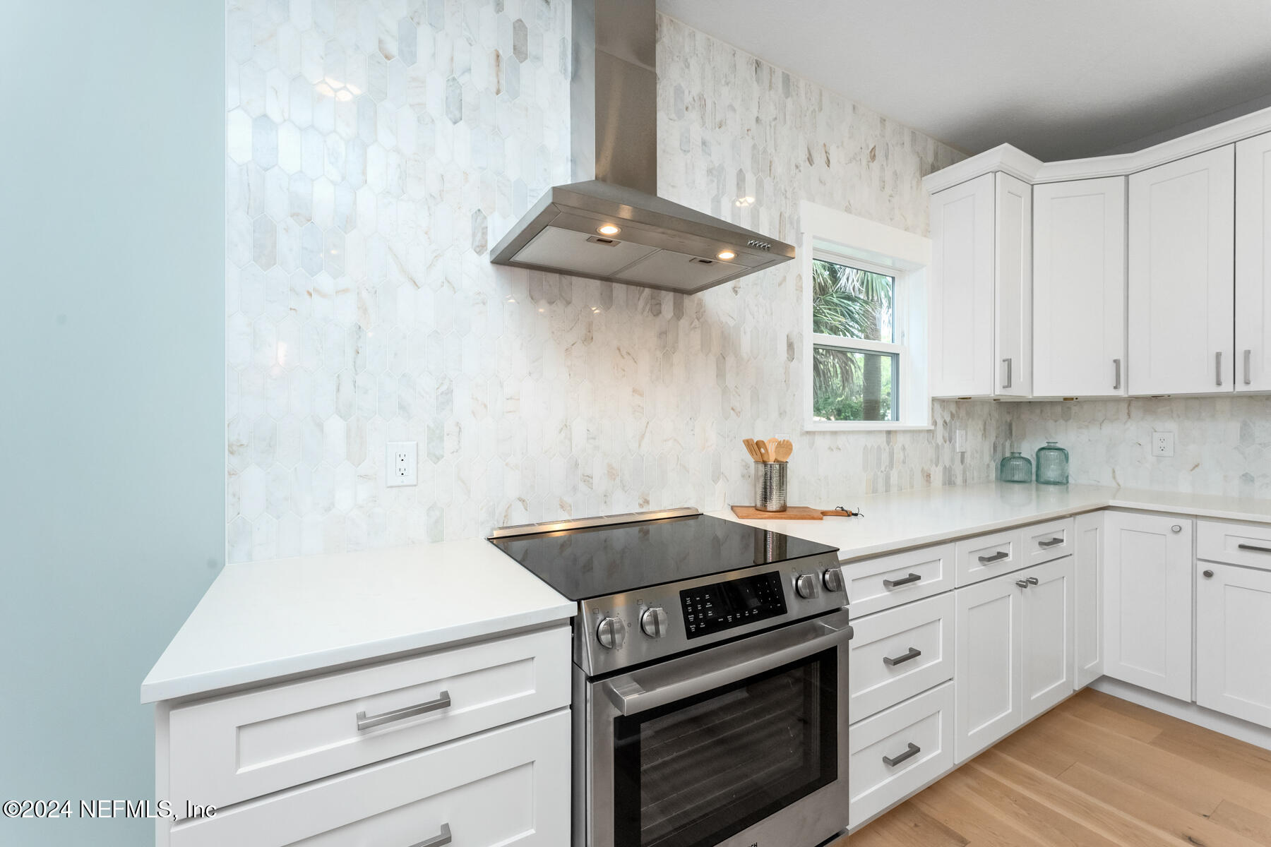 1850 Beach Avenue Atlantic Beach, FL 32233 - Photo 6 of 52 a kitchen with a stove cabinets and wooden floor