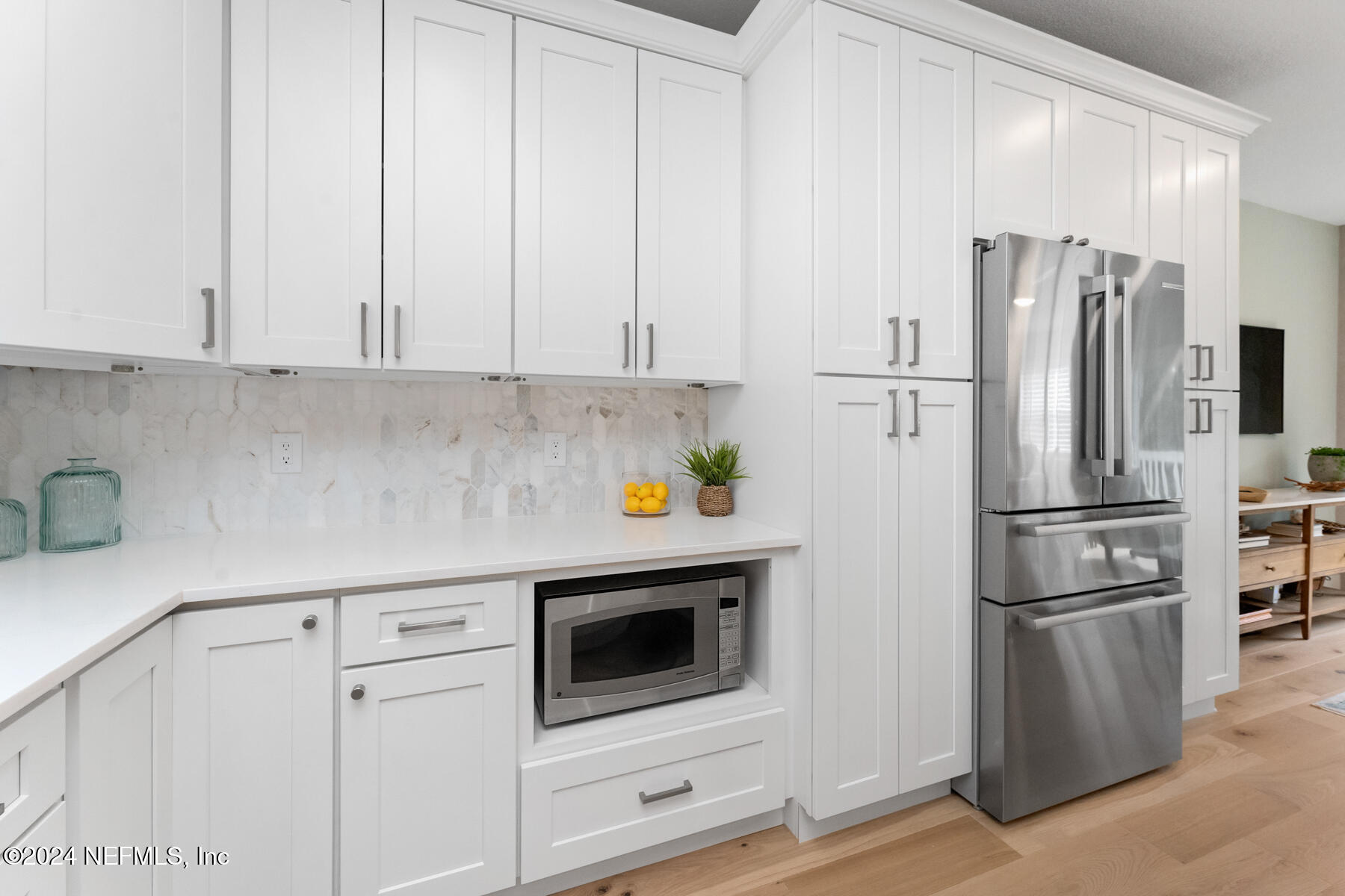 1850 Beach Avenue Atlantic Beach, FL 32233 - Photo 7 of 52 a kitchen with stainless steel appliances white cabinets and a refrigerator