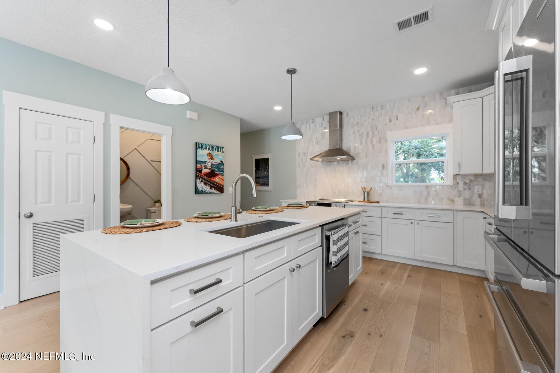 1850 Beach Avenue Atlantic Beach, FL 32233 - Photo 9 of 52 a kitchen with white cabinets and white appliances