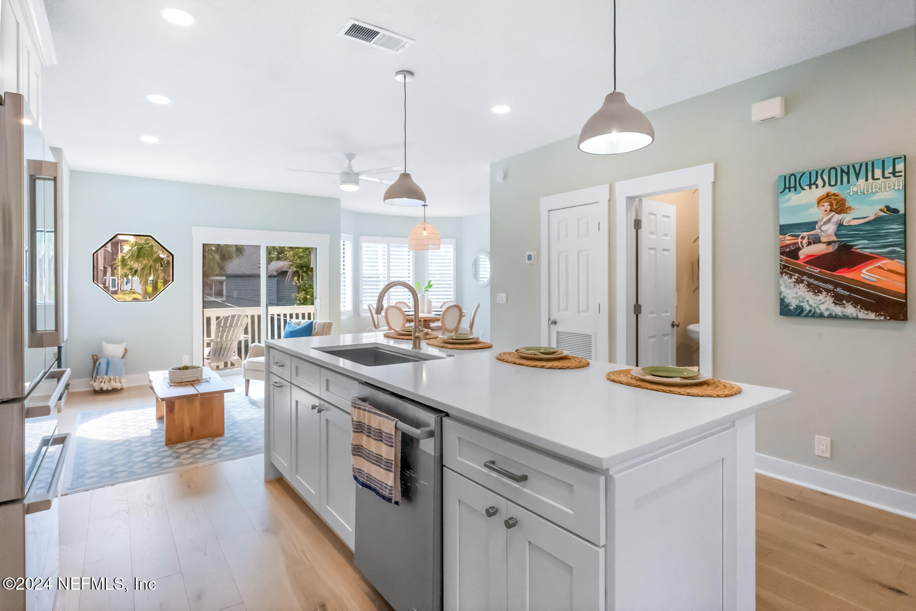 1850 Beach Avenue Atlantic Beach, FL 32233 - Photo 10 of 52 a kitchen with kitchen island granite countertop a stove and a sink