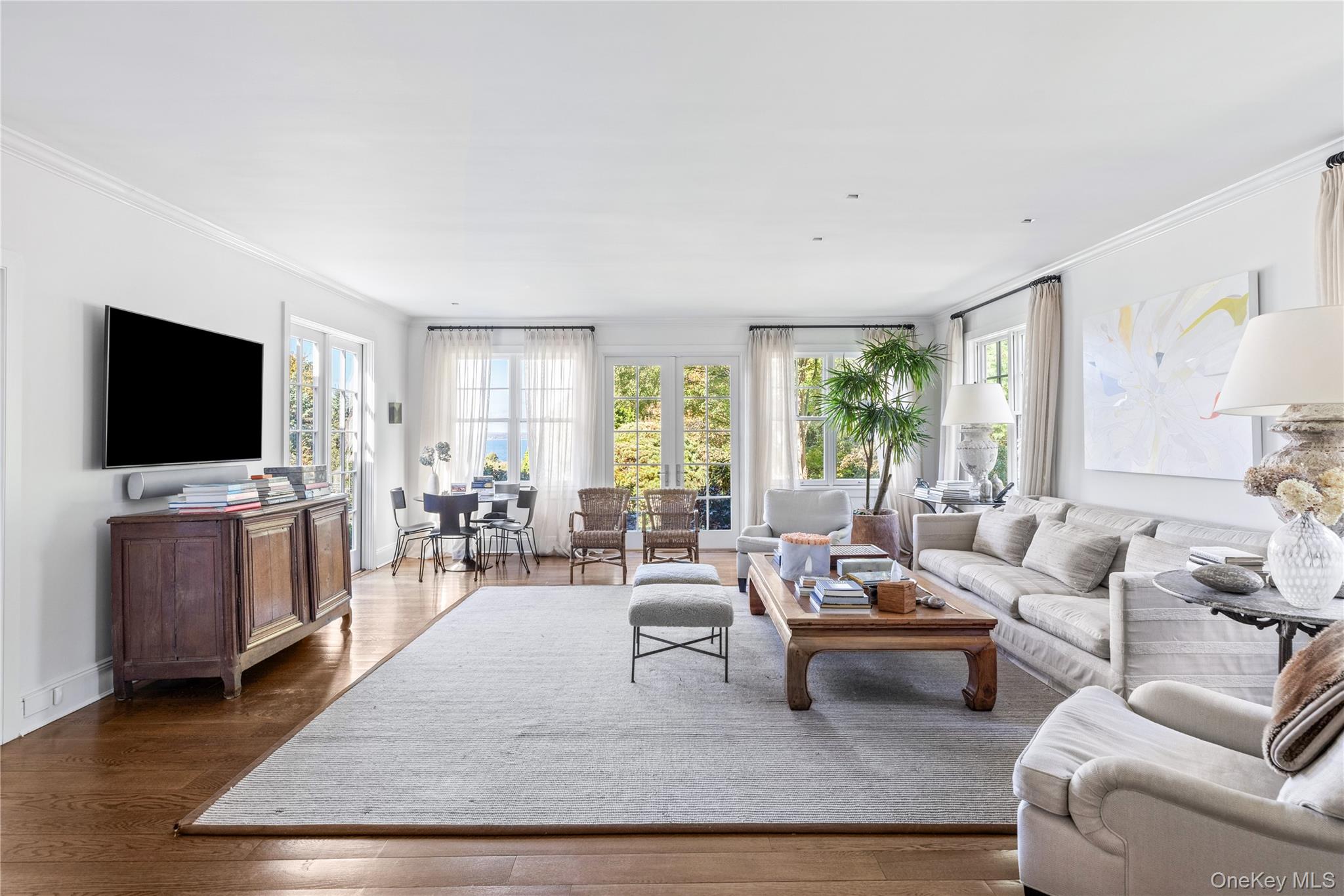 25 Soundview Lane Sands Point, NY 11050 - Photo 16 of 43 a living room with furniture and a flat screen tv