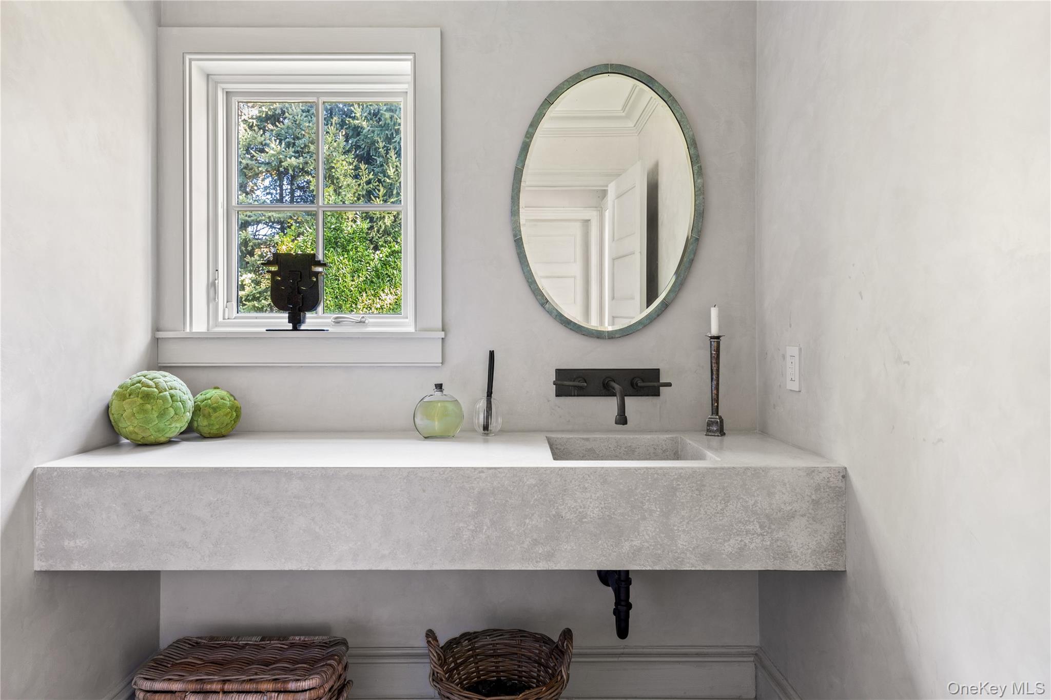 25 Soundview Lane Sands Point, NY 11050 - Photo 17 of 43 a bathroom with a sink and a mirror