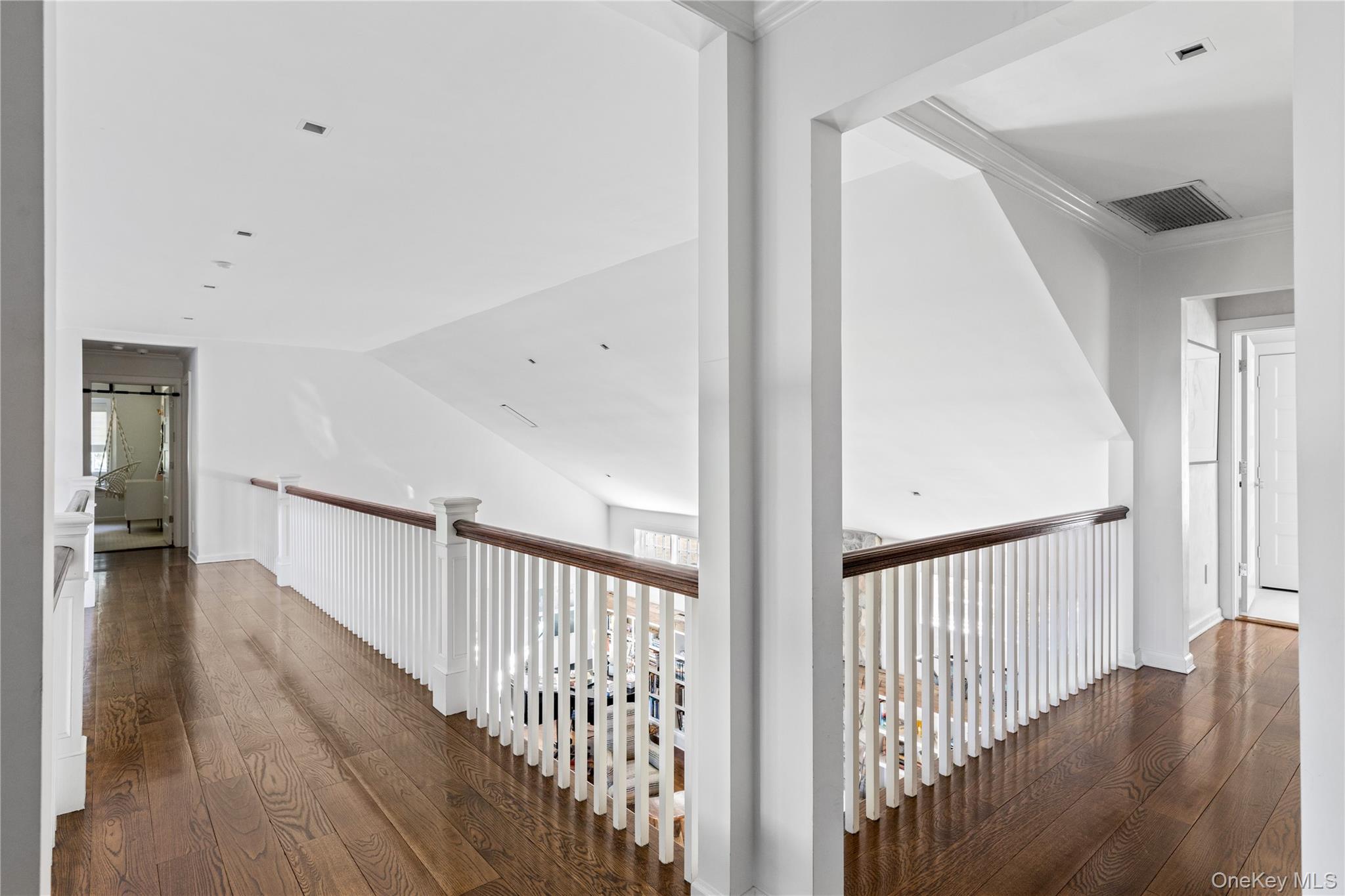 25 Soundview Lane Sands Point, NY 11050 - Photo 23 of 43 a view of a hallway with wooden floor