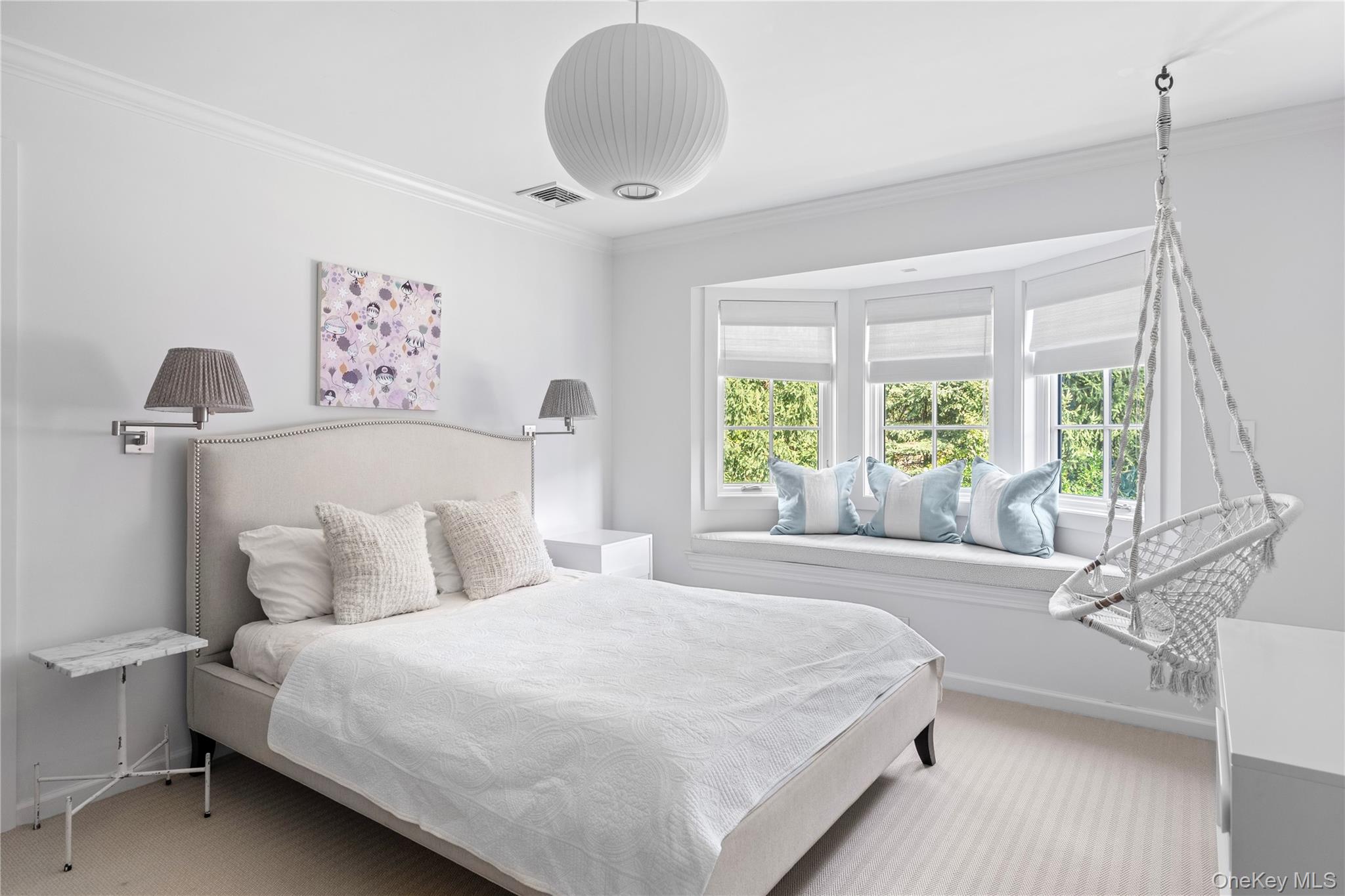 25 Soundview Lane Sands Point, NY 11050 - Photo 26 of 43 a bedroom with a bed and a large window