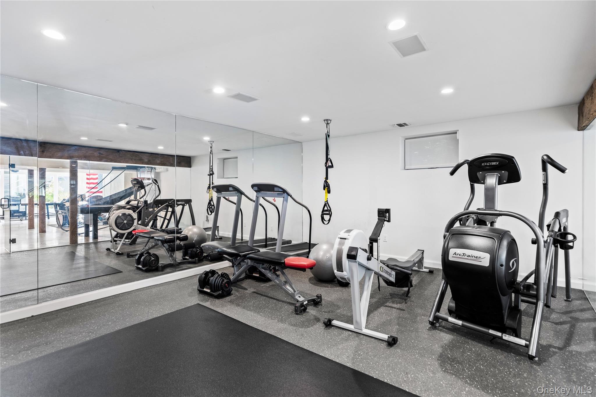 25 Soundview Lane Sands Point, NY 11050 - Photo 32 of 43 a view of a room with gym equipment