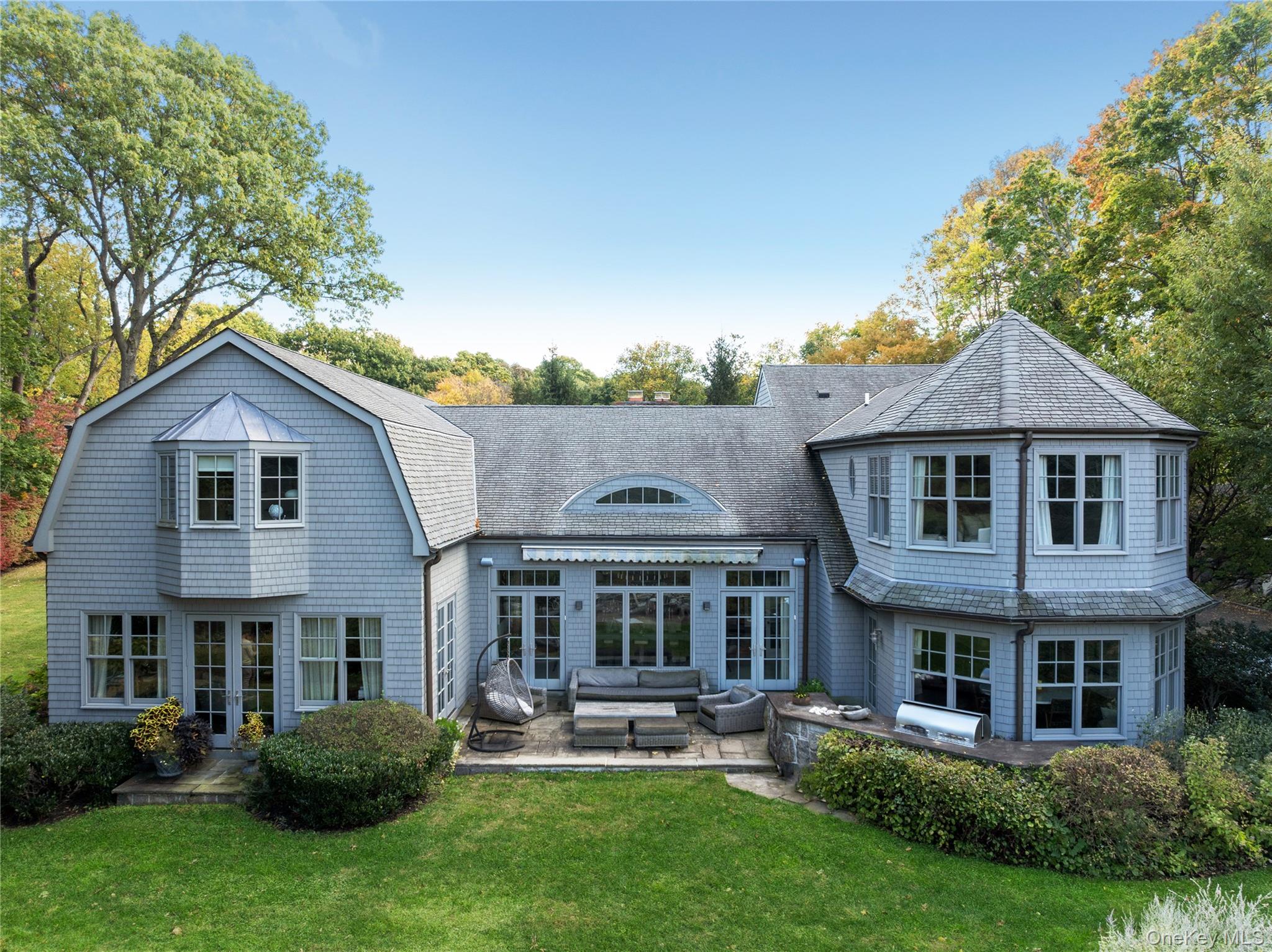 25 Soundview Lane Sands Point, NY 11050 - Photo 33 of 43 a front view of a house with a yard