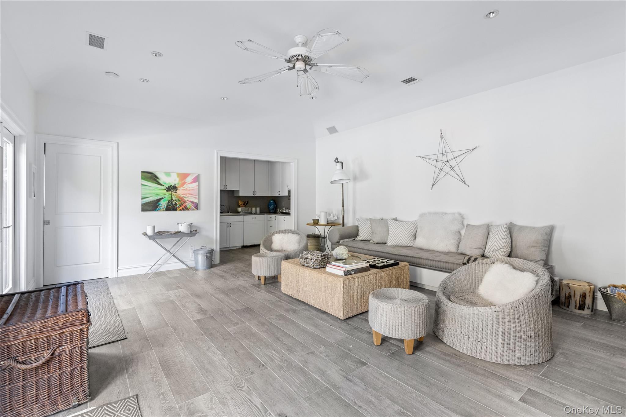 25 Soundview Lane Sands Point, NY 11050 - Photo 35 of 43 a living room with furniture and wooden floor