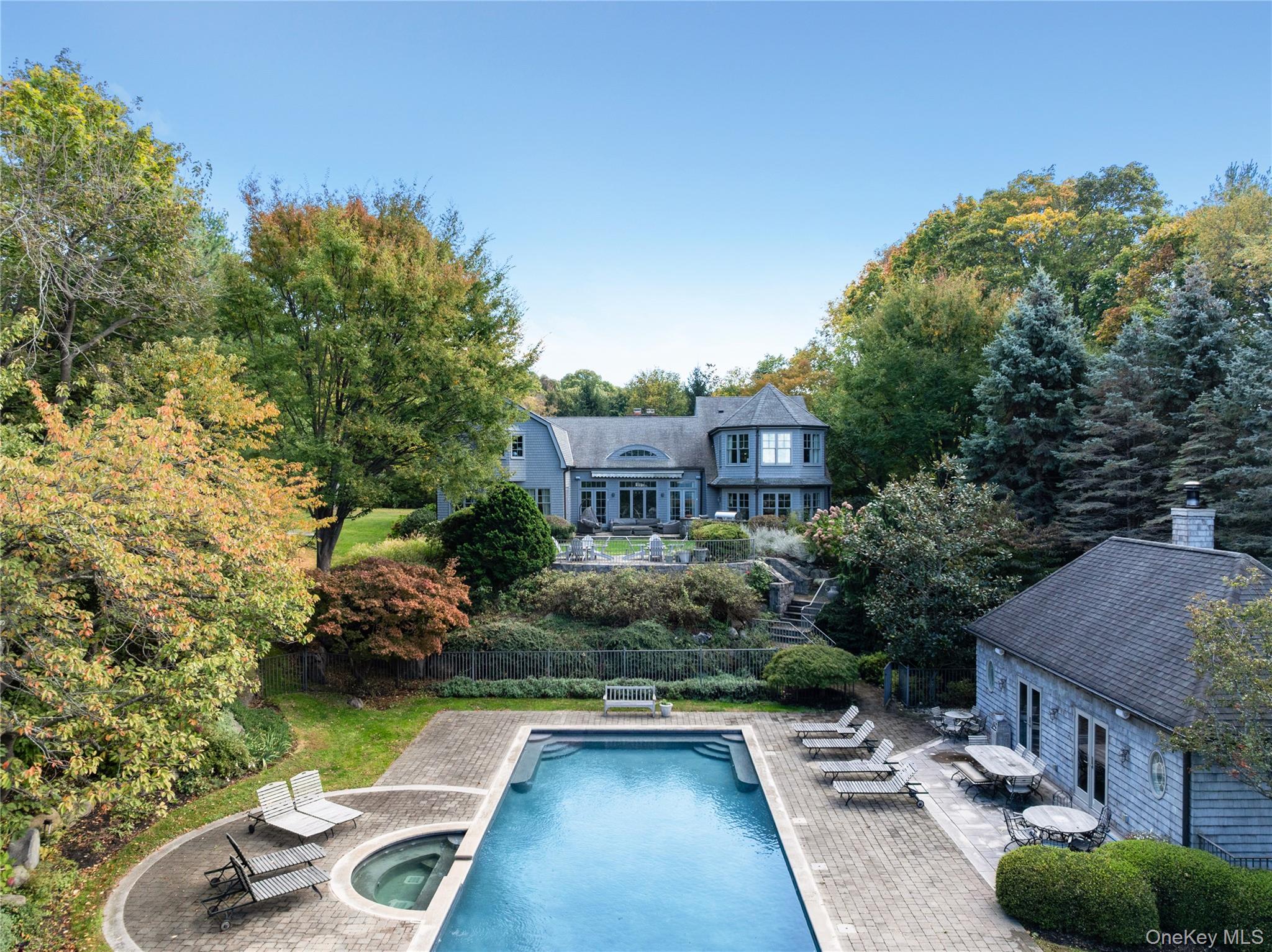 25 Soundview Lane Sands Point, NY 11050 - Photo 4 of 43 a view of a patio with couches table and chairs and potted plants