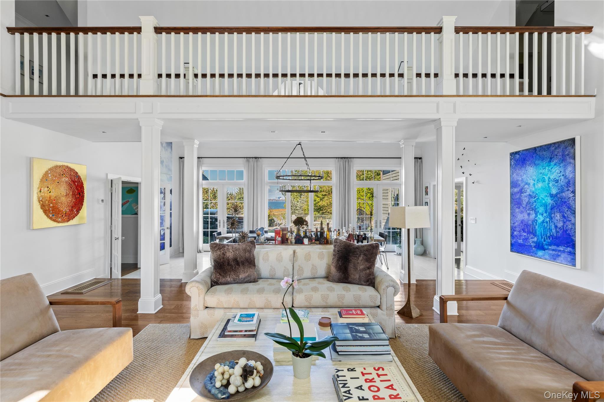 25 Soundview Lane Sands Point, NY 11050 - Photo 8 of 43 a living room with furniture a rug and a floor to ceiling window