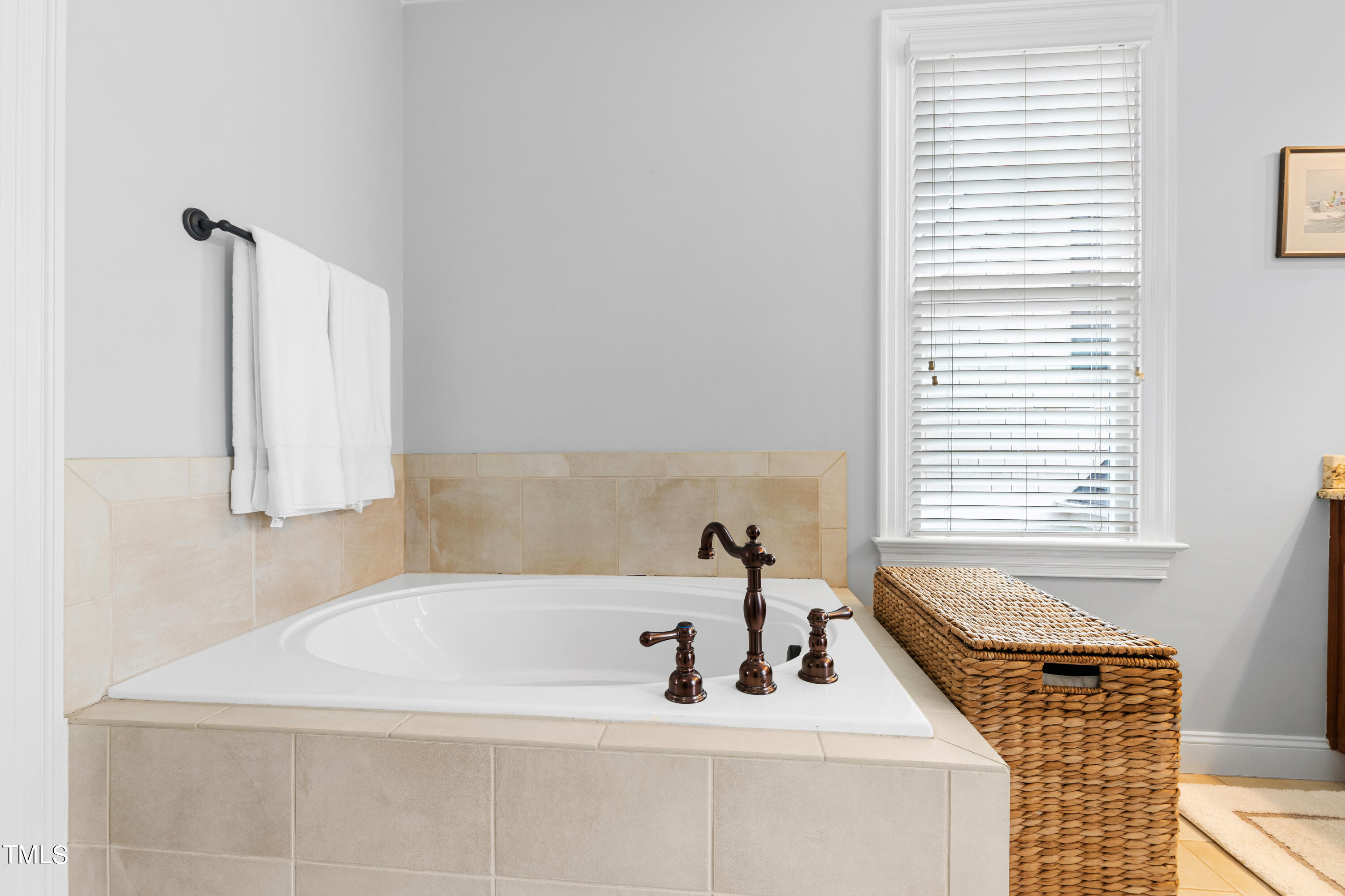 2753 Oberlin Road, Unit 103 Raleigh, NC 27608 - Photo 21 of 30 a bathroom with a sink and a bathtub