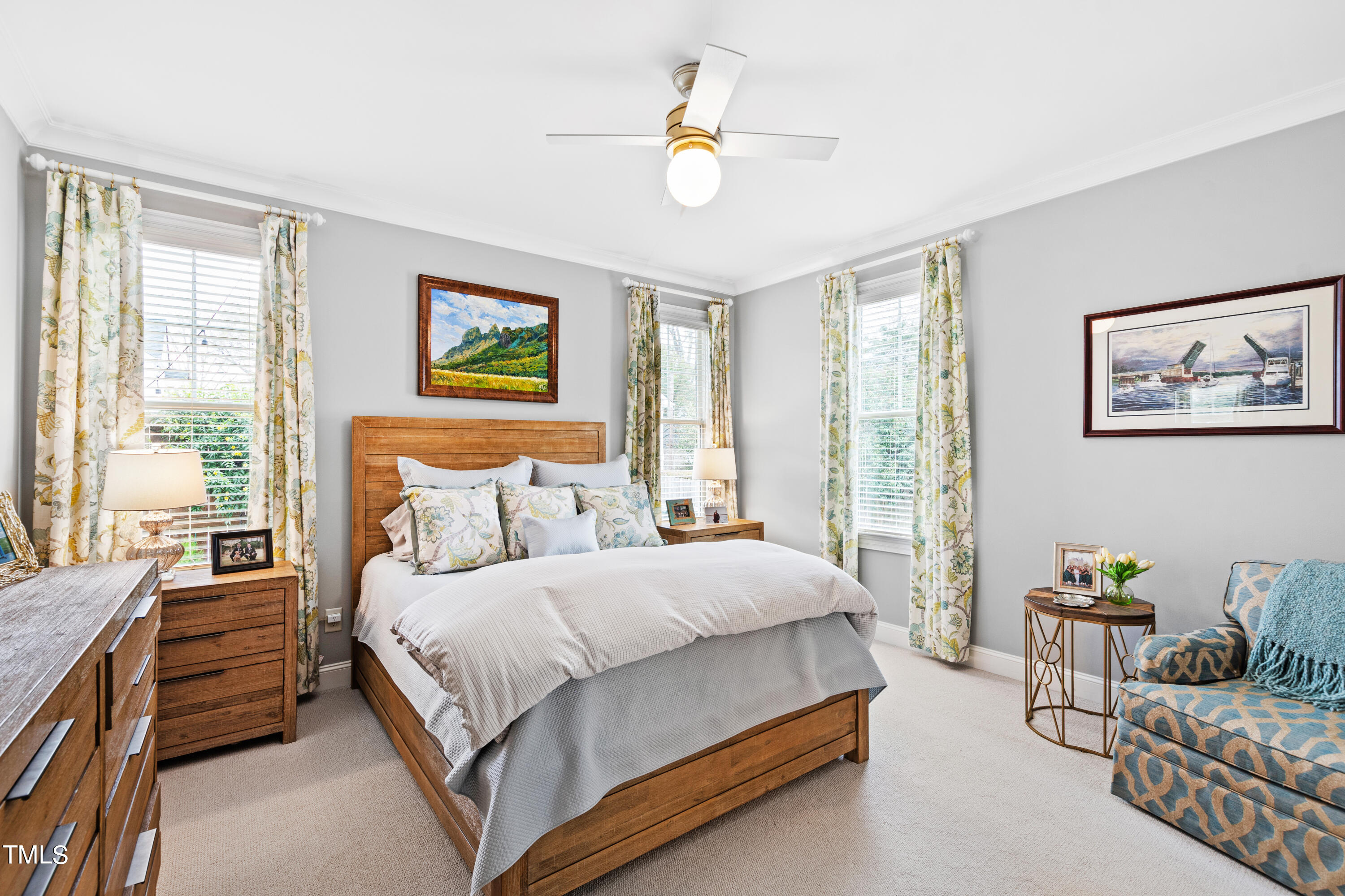 2753 Oberlin Road, Unit 103 Raleigh, NC 27608 - Photo 4 of 30 a bedroom with a bed and a chandelier