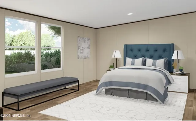 a bedroom with furniture and a large window