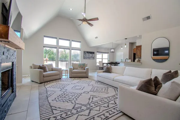 a living room with furniture and a fireplace