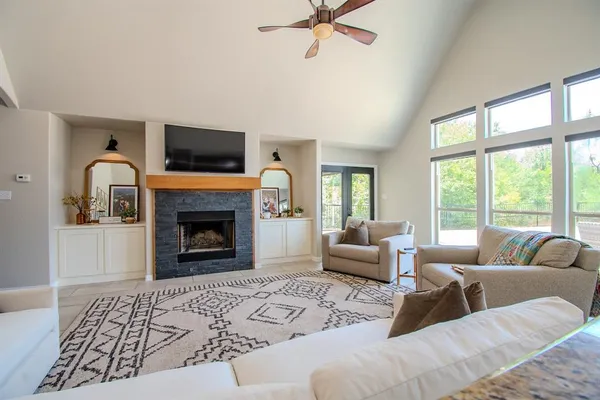 a living room with furniture and a fireplace