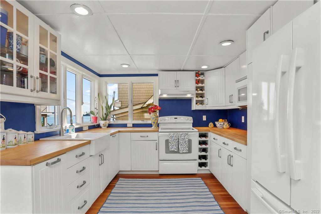 5 Parkview Road Norwalk, CT 06853 - Photo 12 of 38 a kitchen with stainless steel appliances a sink stove and cabinets