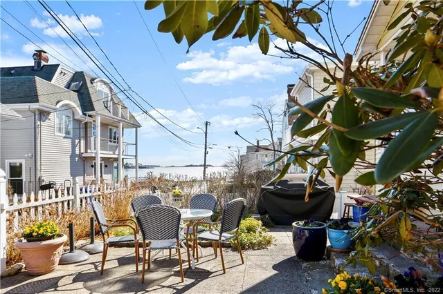 a view of a chairs and table in a patio