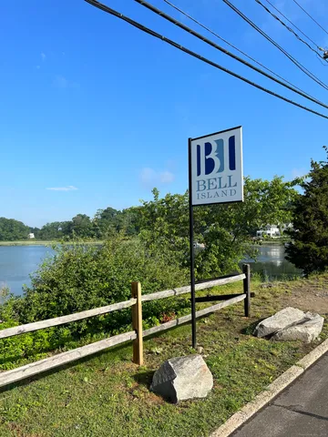 a swimming pool with trees in the background