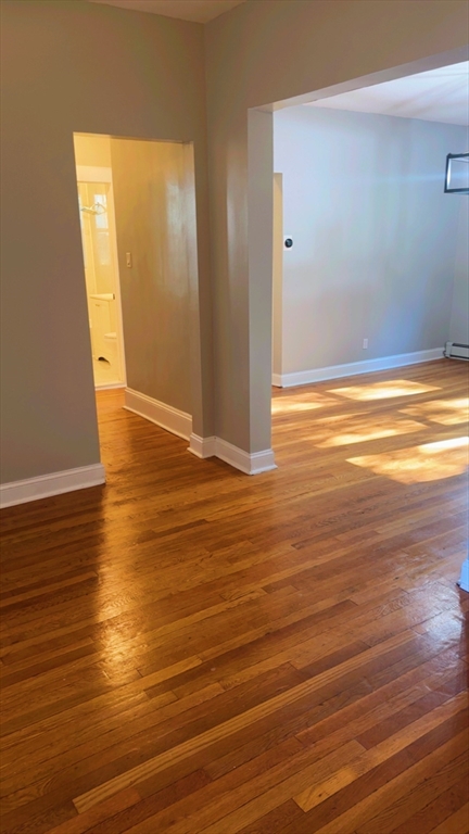 118 Longhill Street, Unit 3 Springfield, MA 01108 - Photo 14 of 24 a view of empty room with wooden floor
