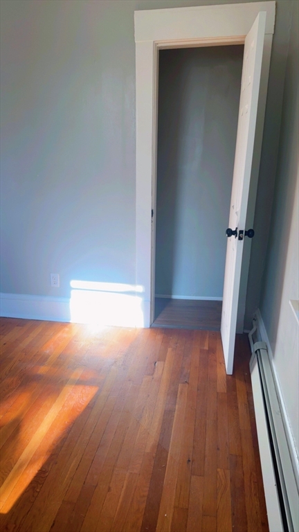 118 Longhill Street, Unit 3 Springfield, MA 01108 - Photo 20 of 24 a view of empty room with wooden floor