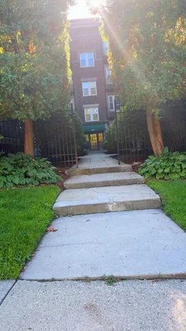 a view of a building with a yard