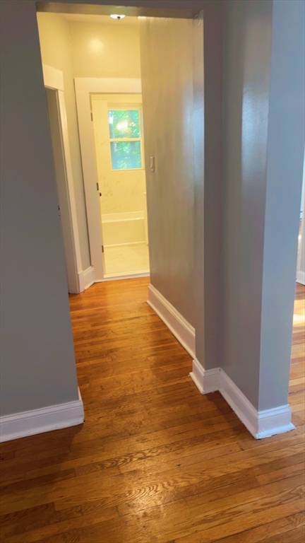 118 Longhill Street, Unit 3 Springfield, MA 01108 - Photo 23 of 24 a view of an empty room with wooden floor