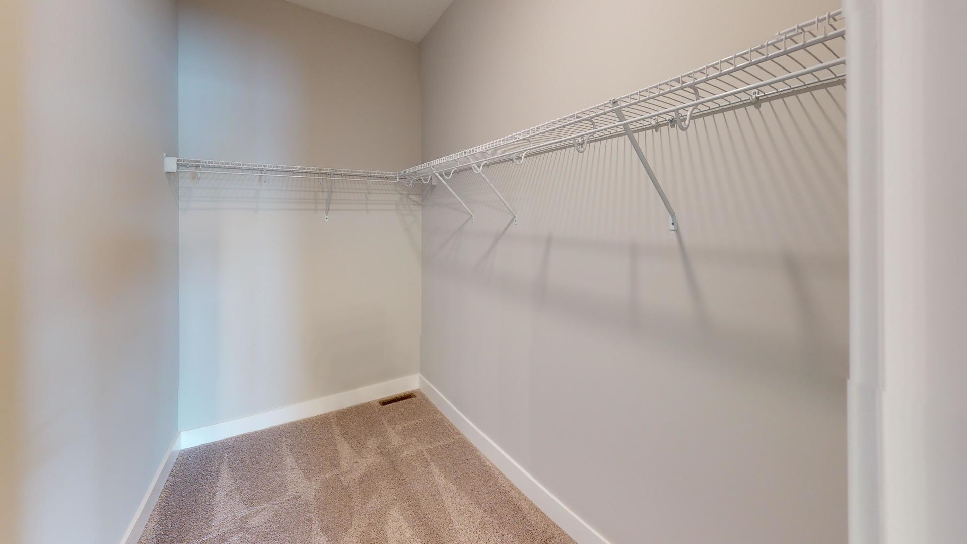 8-2 West Orchid Lane, Unit 2 Channahon, IL 60410 - Photo 18 of 28 a view of a room with racks on the wall