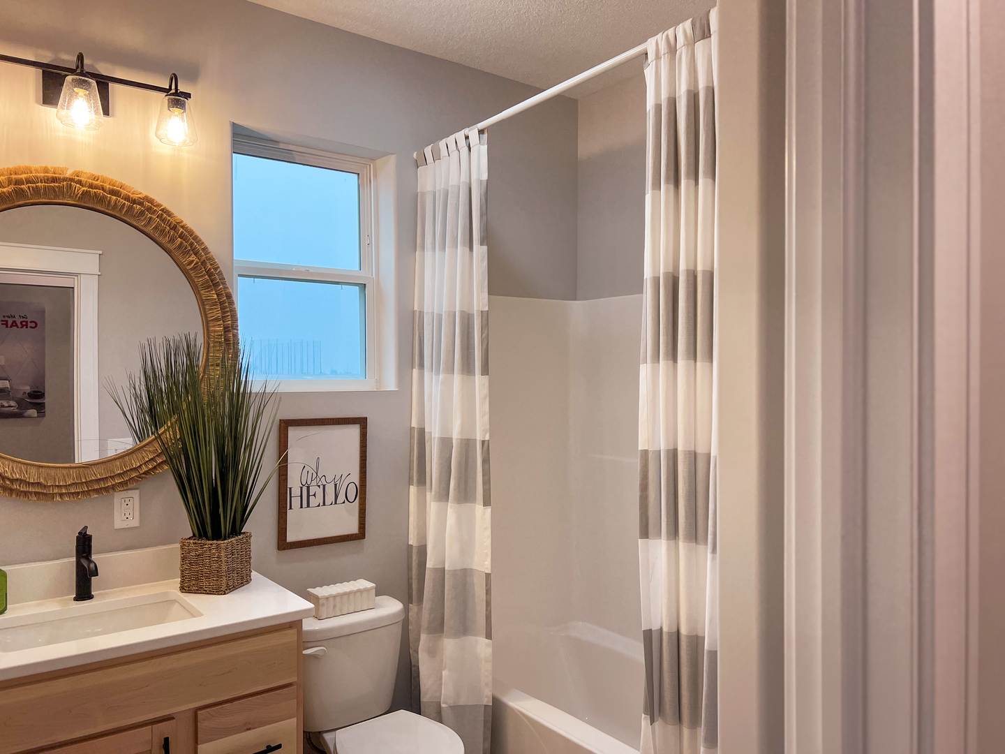 8-2 West Orchid Lane, Unit 2 Channahon, IL 60410 - Photo 27 of 28 a bathroom with a sink and a mirror