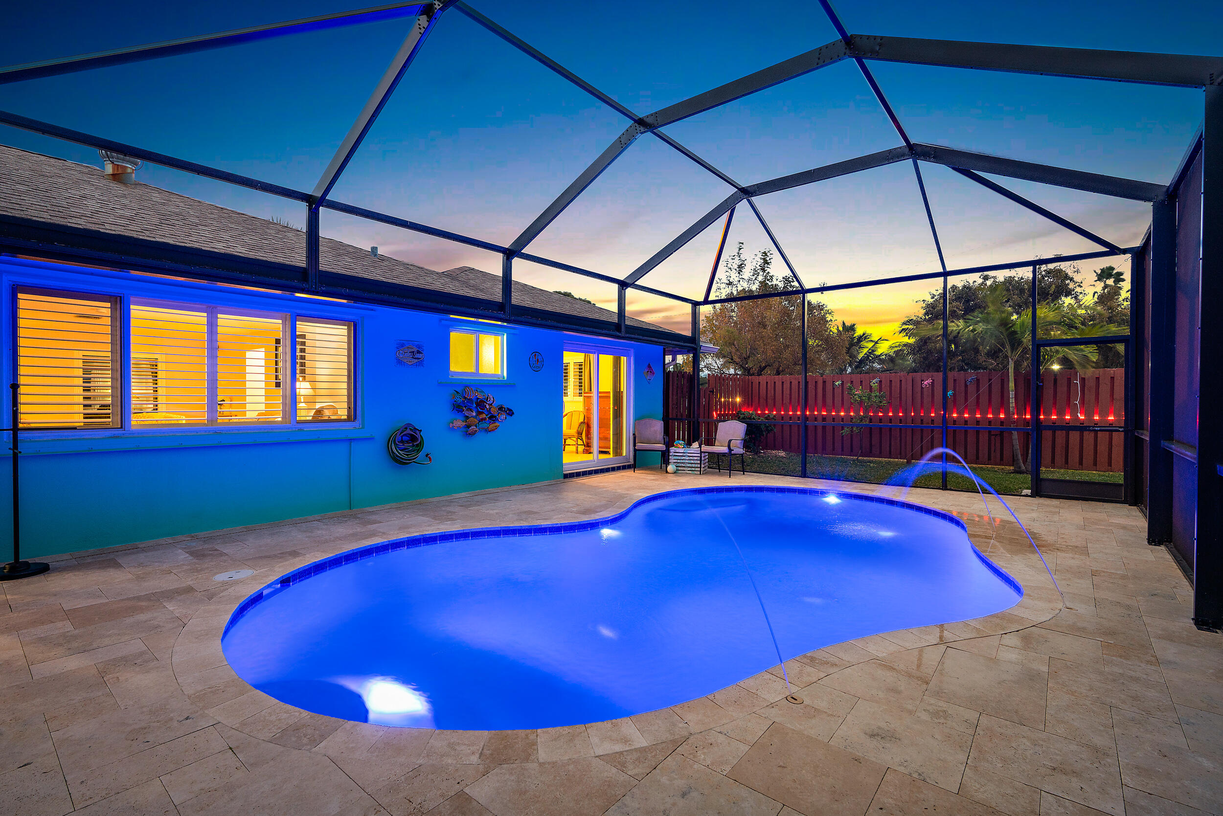 100 Windsor Road West Jupiter, FL 33469 - Photo 3 of 11 a view of a swimming pool with seating area