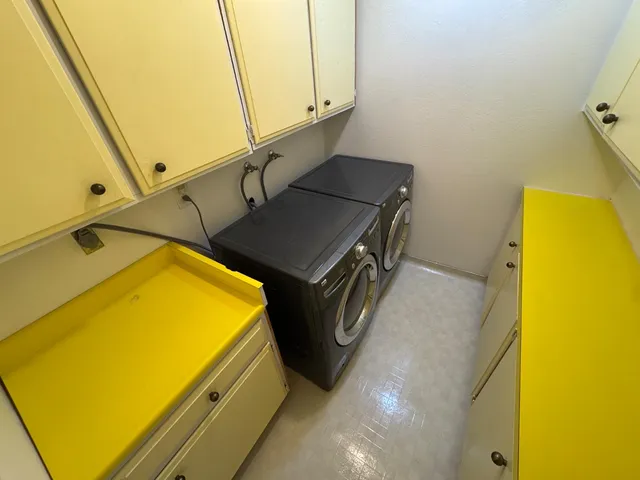 a bathroom with a tub and shower